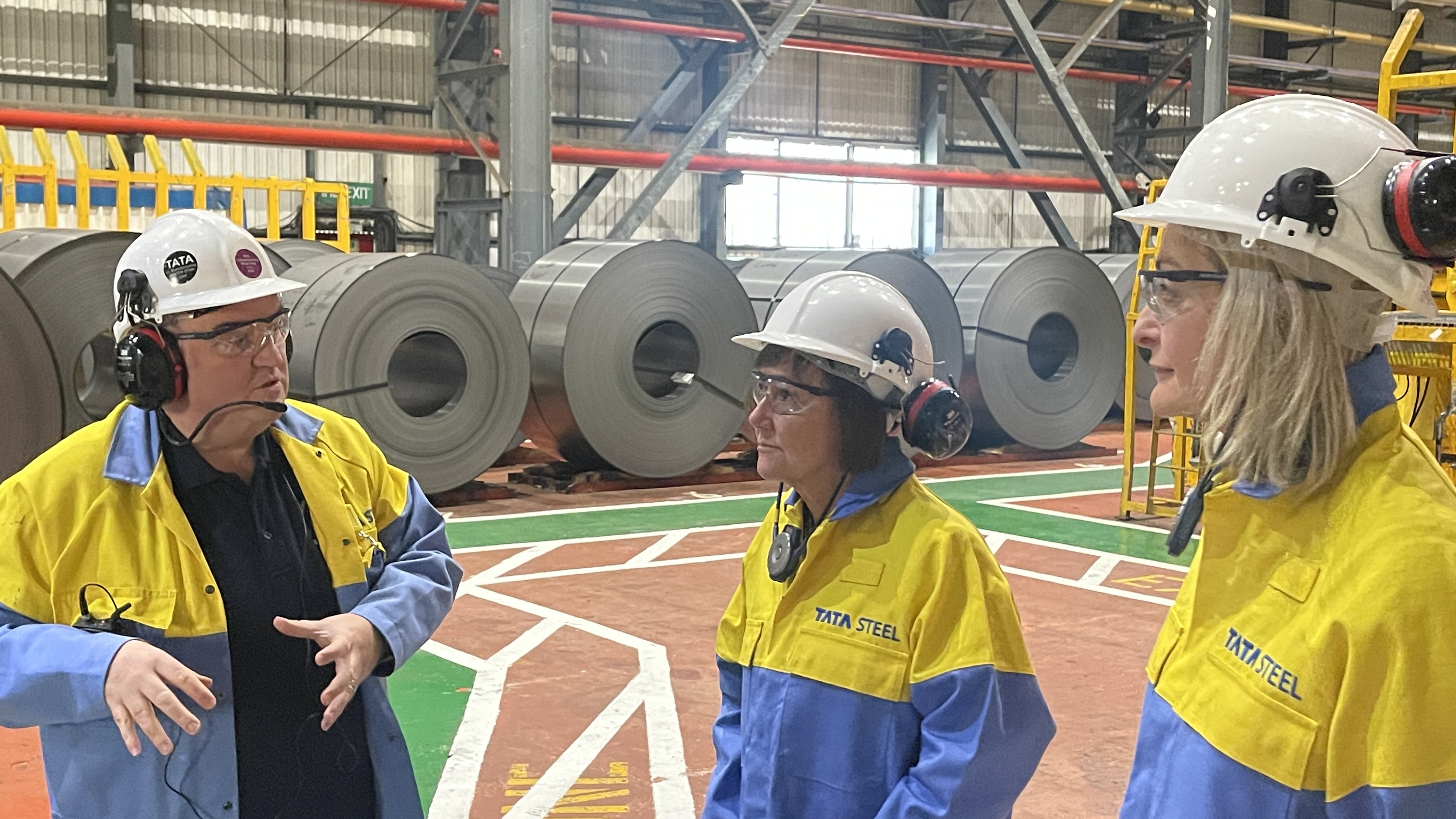 Works Manager Craig Phillips welcomes Jo Stevens MP and Jess Morden MP to the Zodiac line in Llanwern