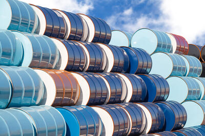A pile of blue oil drums