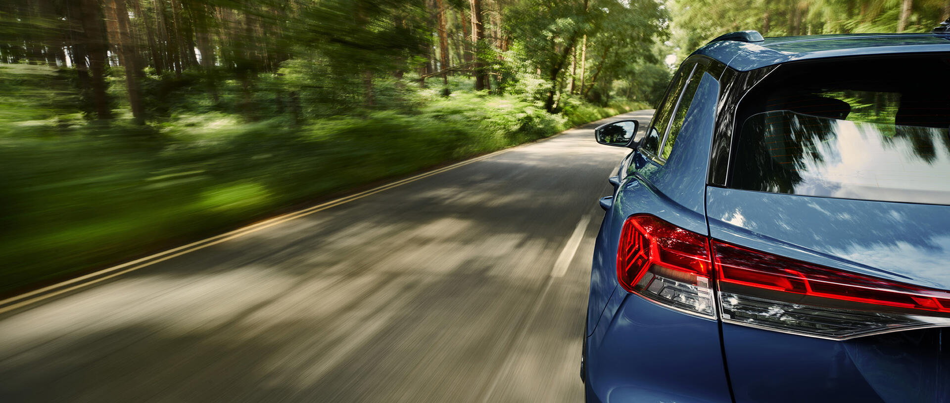 Automotive moving blue car