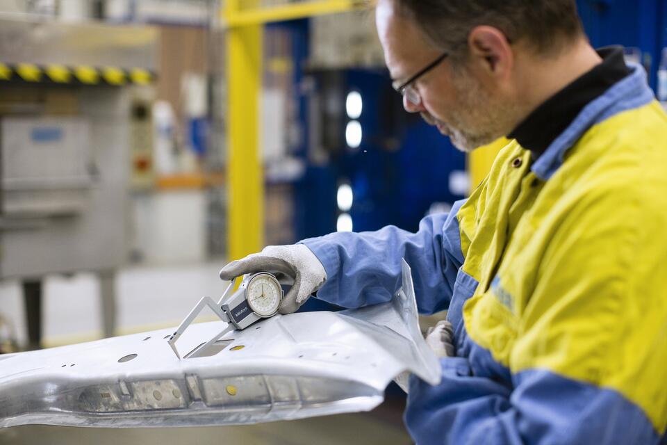 Quality testing on a panel being carried out by a technician