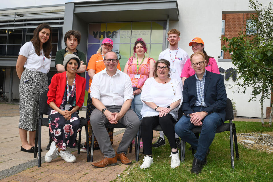 Caption: UKSE regional executive Mike Lowe (front row, second left) and Midlands area manager Steve Grice (front row, far right) with YMCA director of communities & partnerships Nicky Twemlow (front row, second right) and young people at YMCA North Staffordshire headquarters