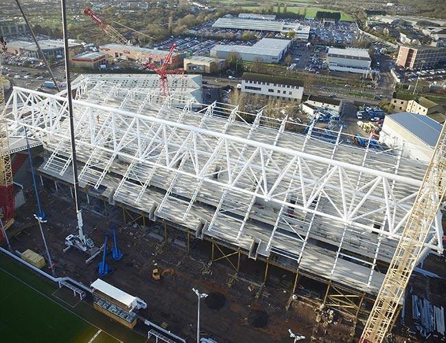 First pair of rafters being lifted